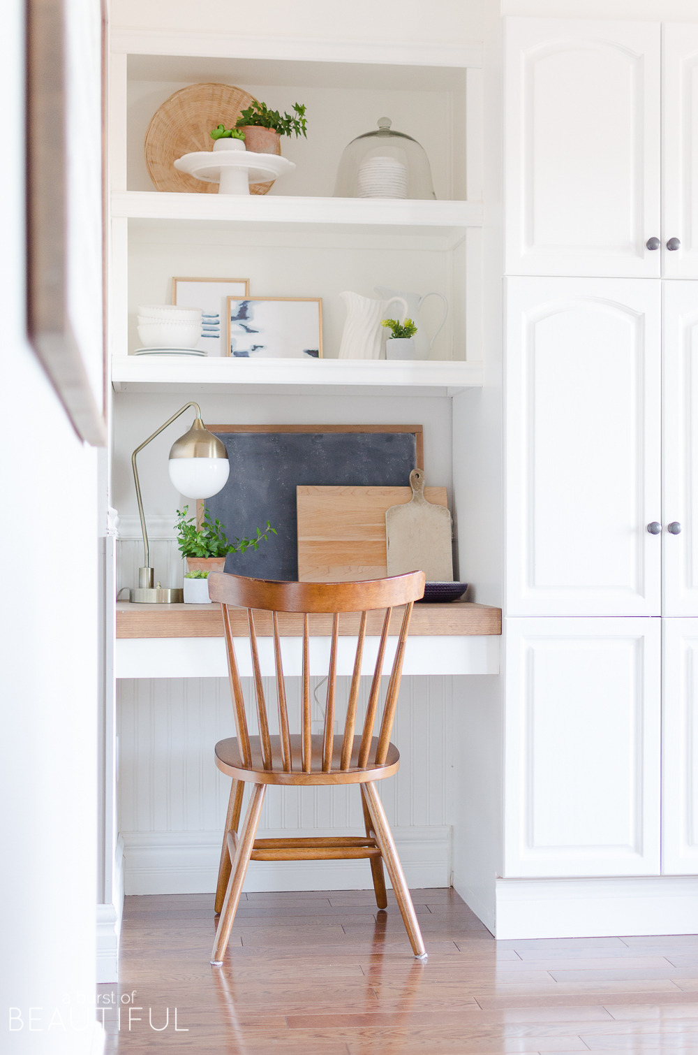 Create warmth in a white kitchen using cutting boards - Duke Manor Farm by  Laura Janning